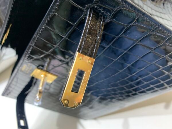 International Express 89 Nior Kelly 25CM Niloticus Leather Gold Hardware